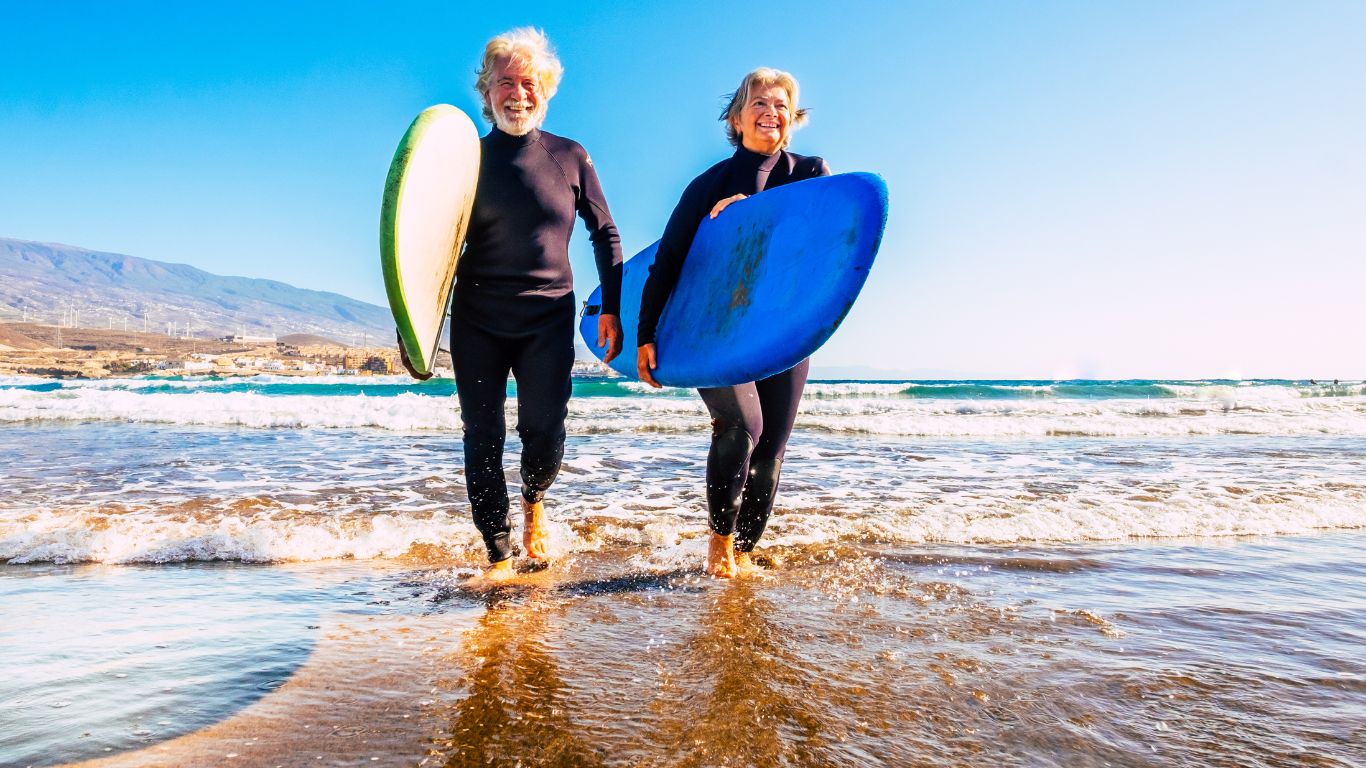 old couple engage in surfing