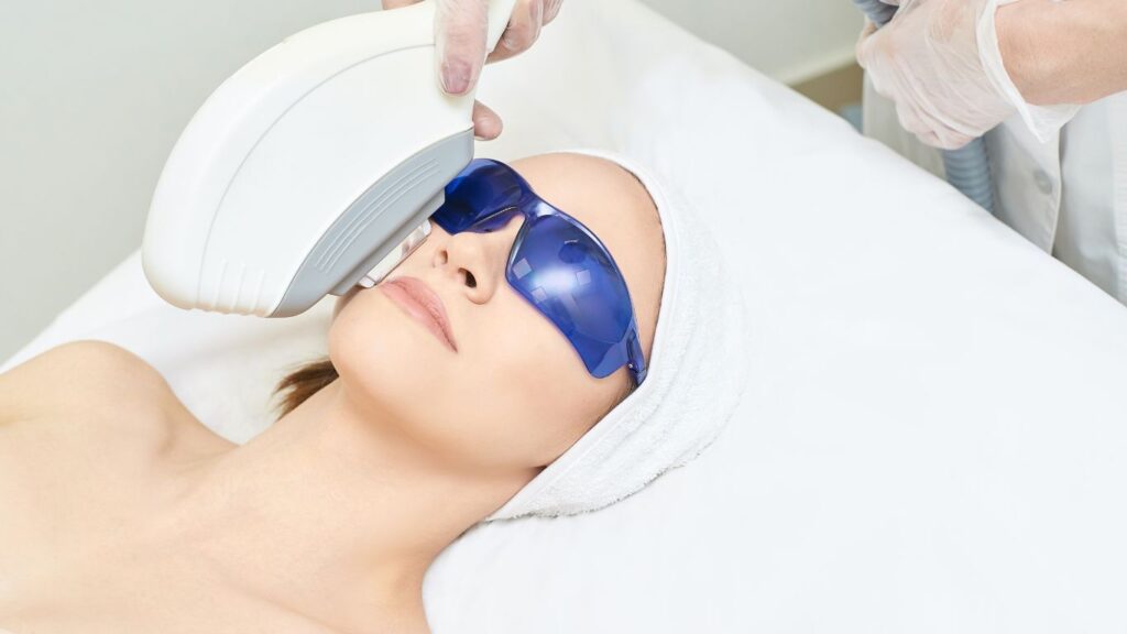 woman undergoing skin laser on her face