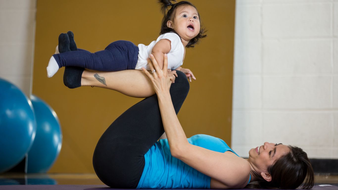 mother playing with her little girl